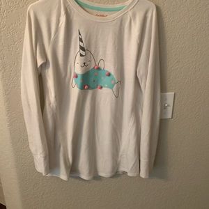 A long sleeve white tee with narwhal